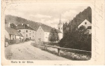 Župnišče s šolo, cerkev sv. Marije in gostilna, pod cesto Radoljna. 
Poslana 28. 9. 1903. title=